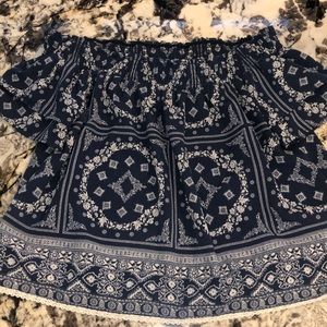 Off the shoulder shirt brand is Belk’s